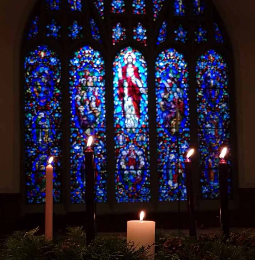 Hills Church photo Advent candle with stained glass backdrop